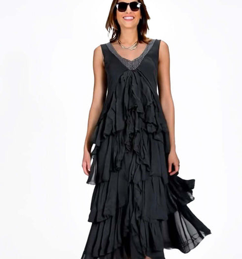 Elegant long black chiffon dress with thin straps, cascading ruffles, perfect for casual and evening events.